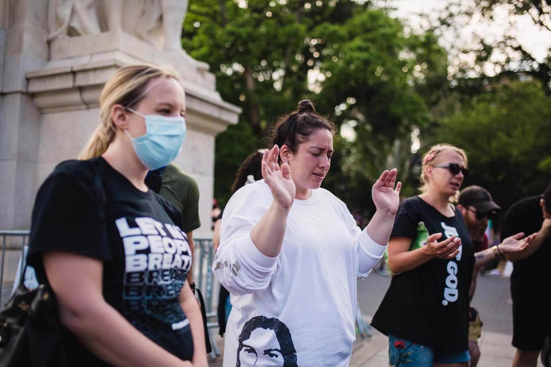 women praying outside