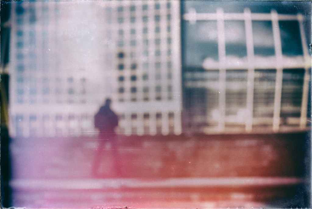 film photography of aman and buildings