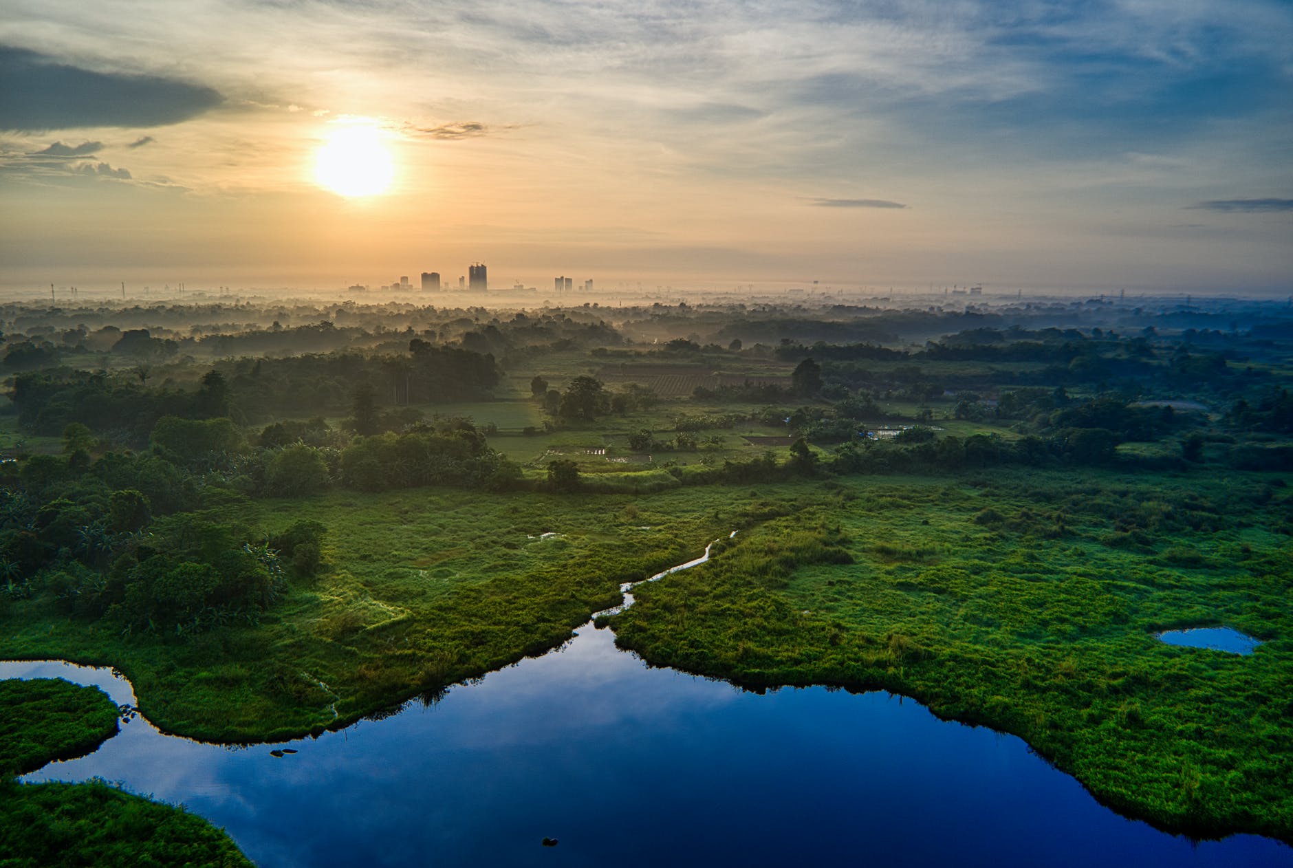aerial photography of landscape with view of sunset