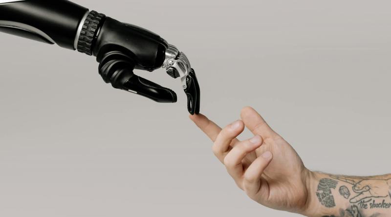 bionic hand and human hand finger pointing
